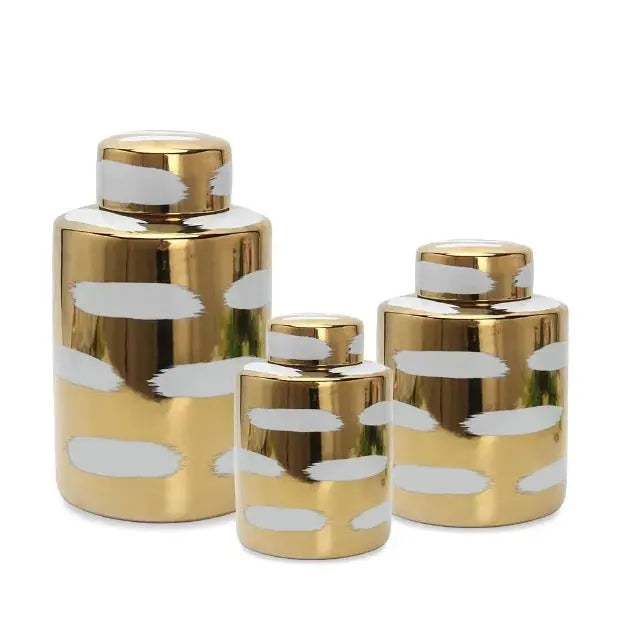The Gold Porcelain Jar is an embodiment of elegance, marrying the timeless charm of porcelain with the lavish allure of gold. This exquisite decorative piece is a testament to meticulous craftsmanship,